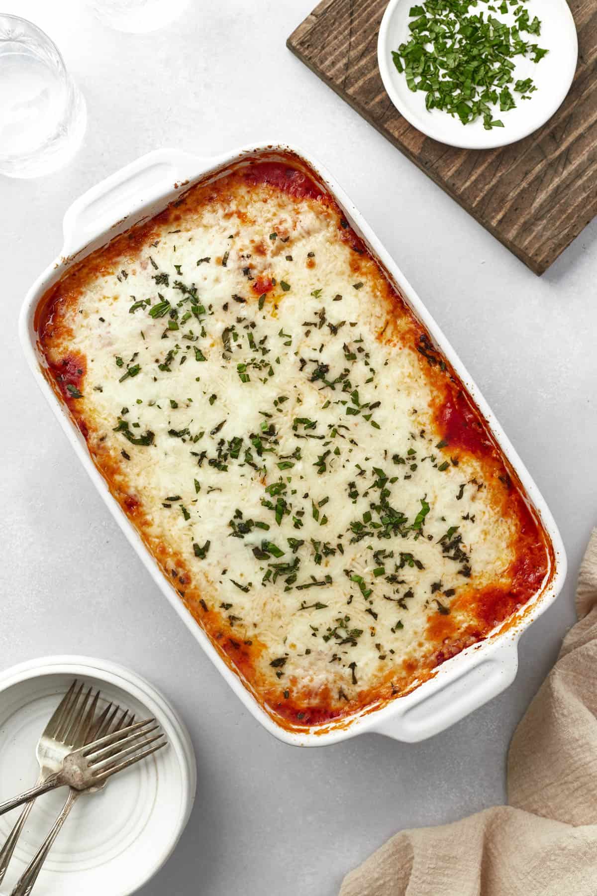 An overhead image of an easy ravioli lasagna baked in a casserole dish.