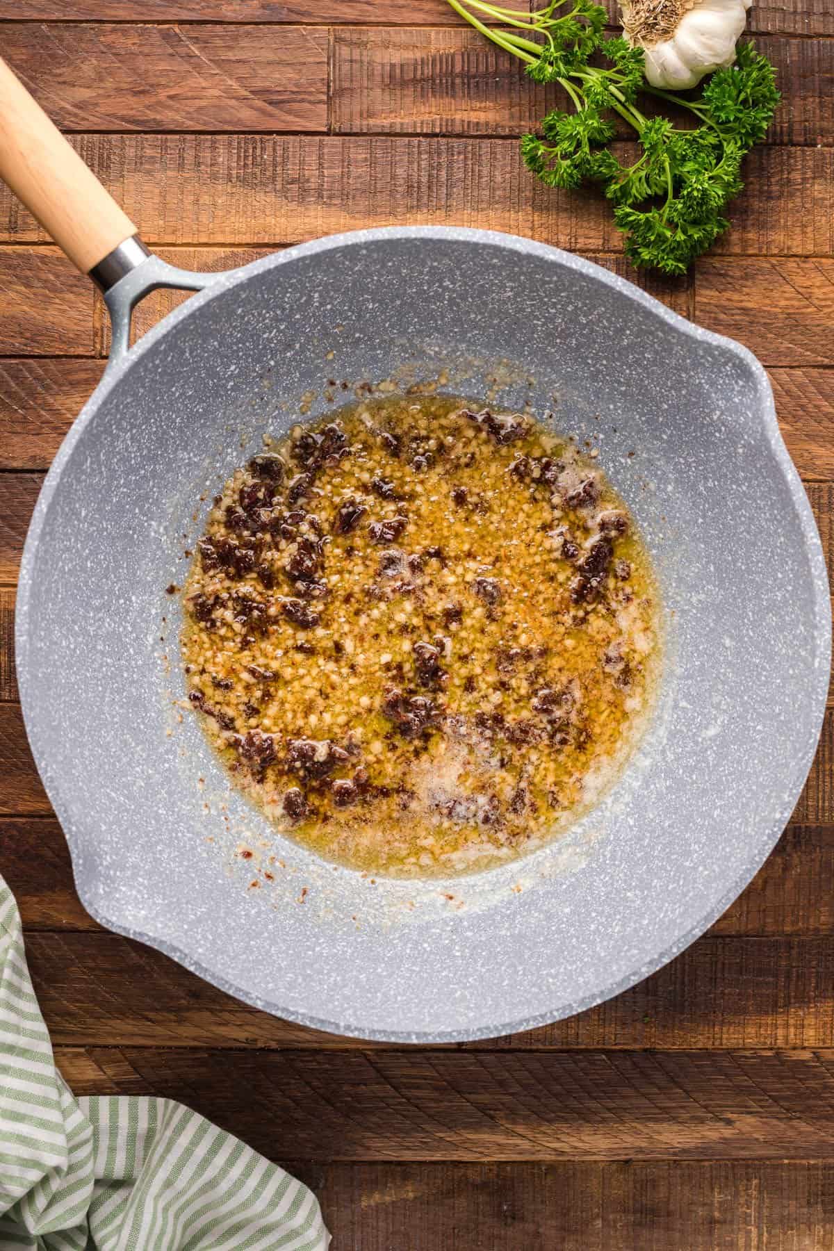 Sauteed garlic in a pan.