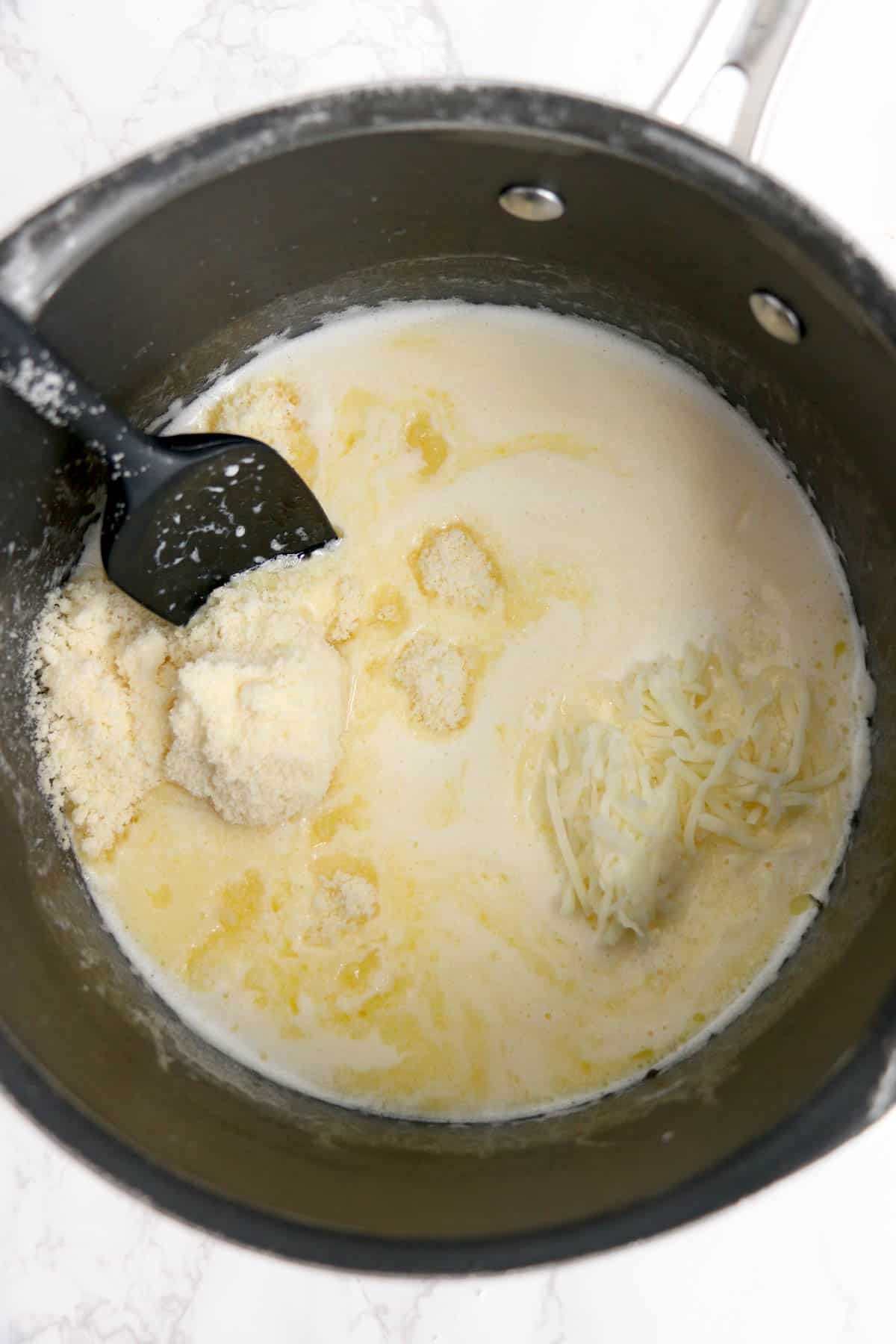 Making a creamy white sauce for copycat Olive Garden Stuffed Shells.