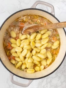 Stirring gnocchi into soup