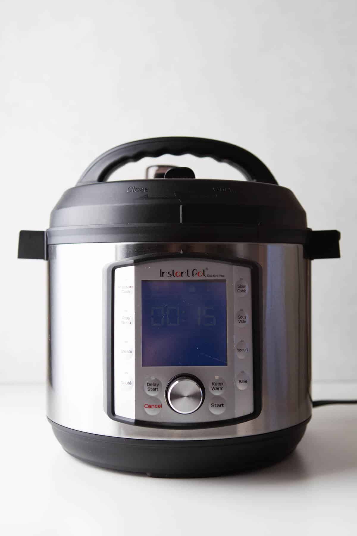 An image of an Instant Pot set to cooked tomato soup.