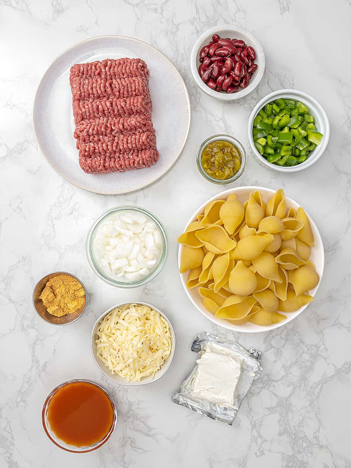 Overhead view of ingredients for taco stuffed shells