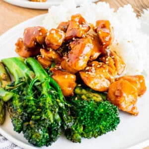 A plate of chicken teriyaki with vegetables and rice.
