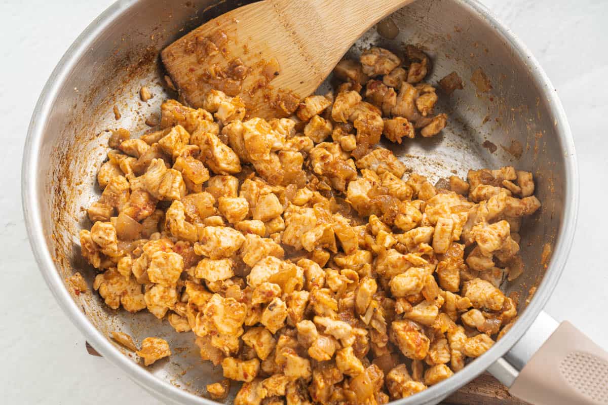 Cooked and seasoned fajita chicken in a pan.