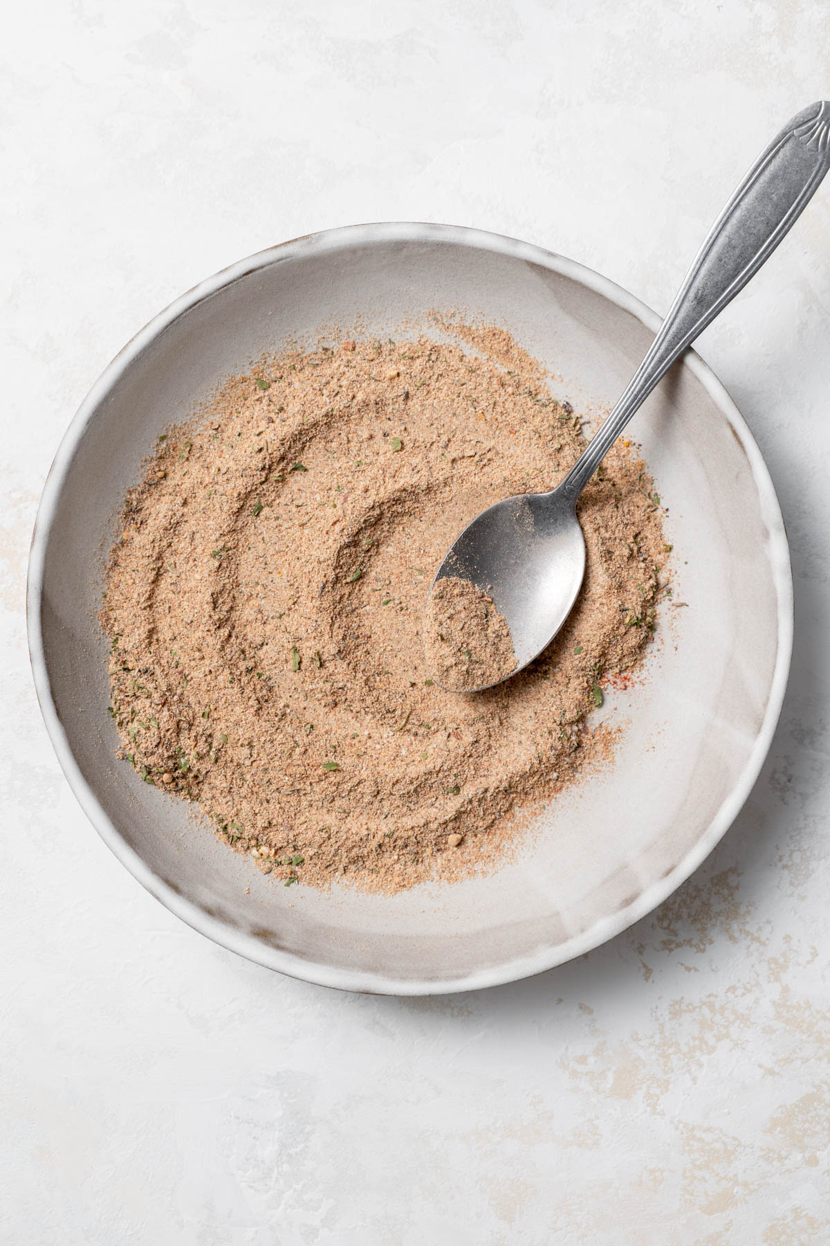 Overhead image of spices blended in a shallow bowl. 