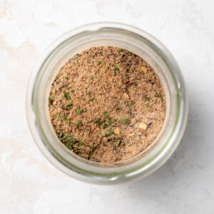 An overhead image of homemade jerk seasoning in a jar.