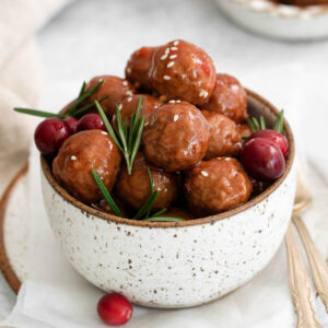 A bowl of cranberry crock pot meatballs.
