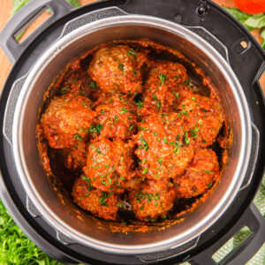 An overhead image of meatballs in the instant pot with marinara sauce.
